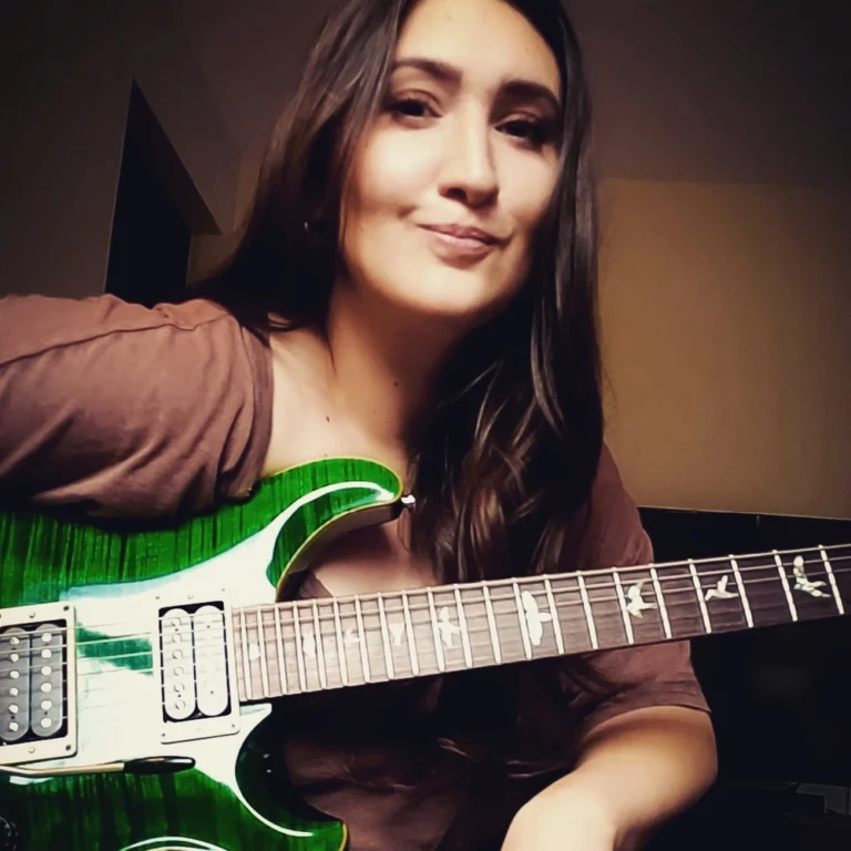 Bailey portrait with guitar for Avid Guitar Studio student portal