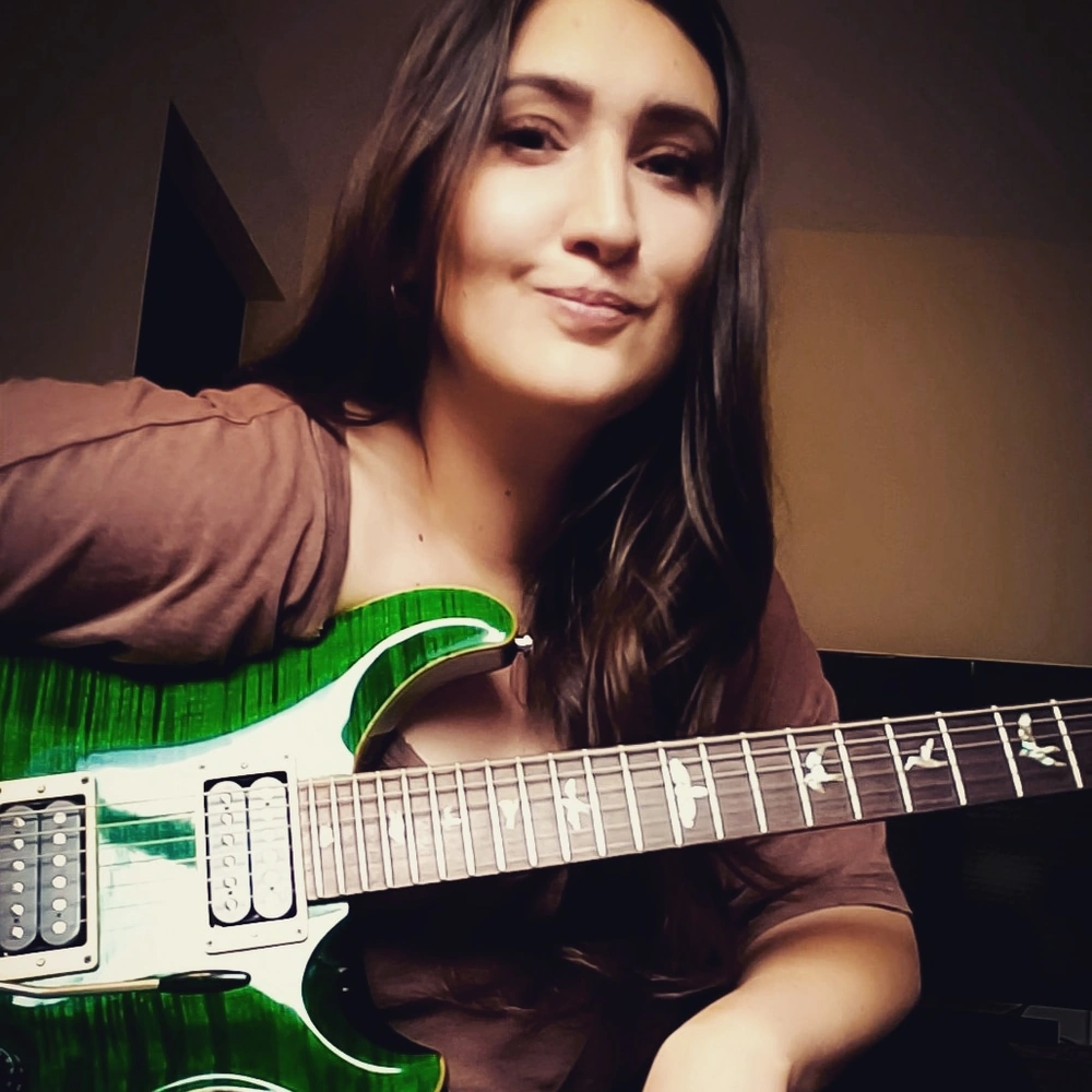 Bailey portrait with guitar for Avid Guitar Studio student portal